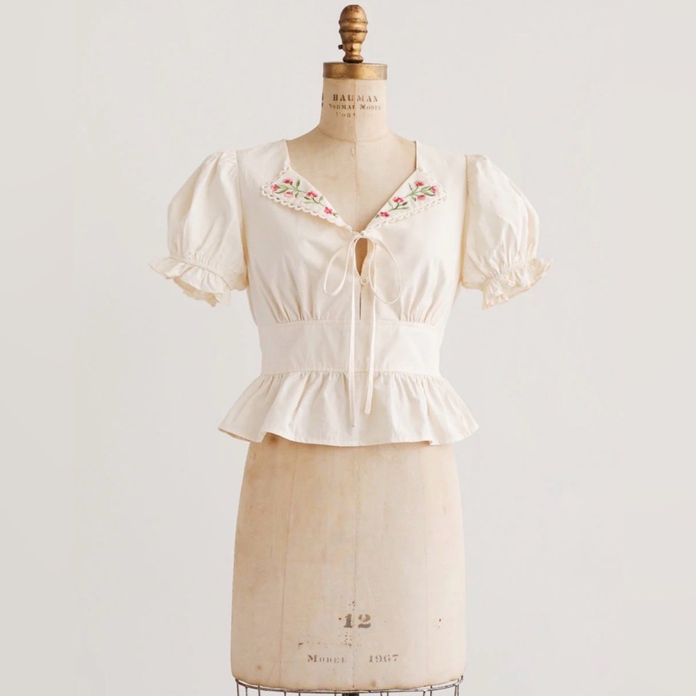 50. Ivory Floral Embroidered Peplum Blouse